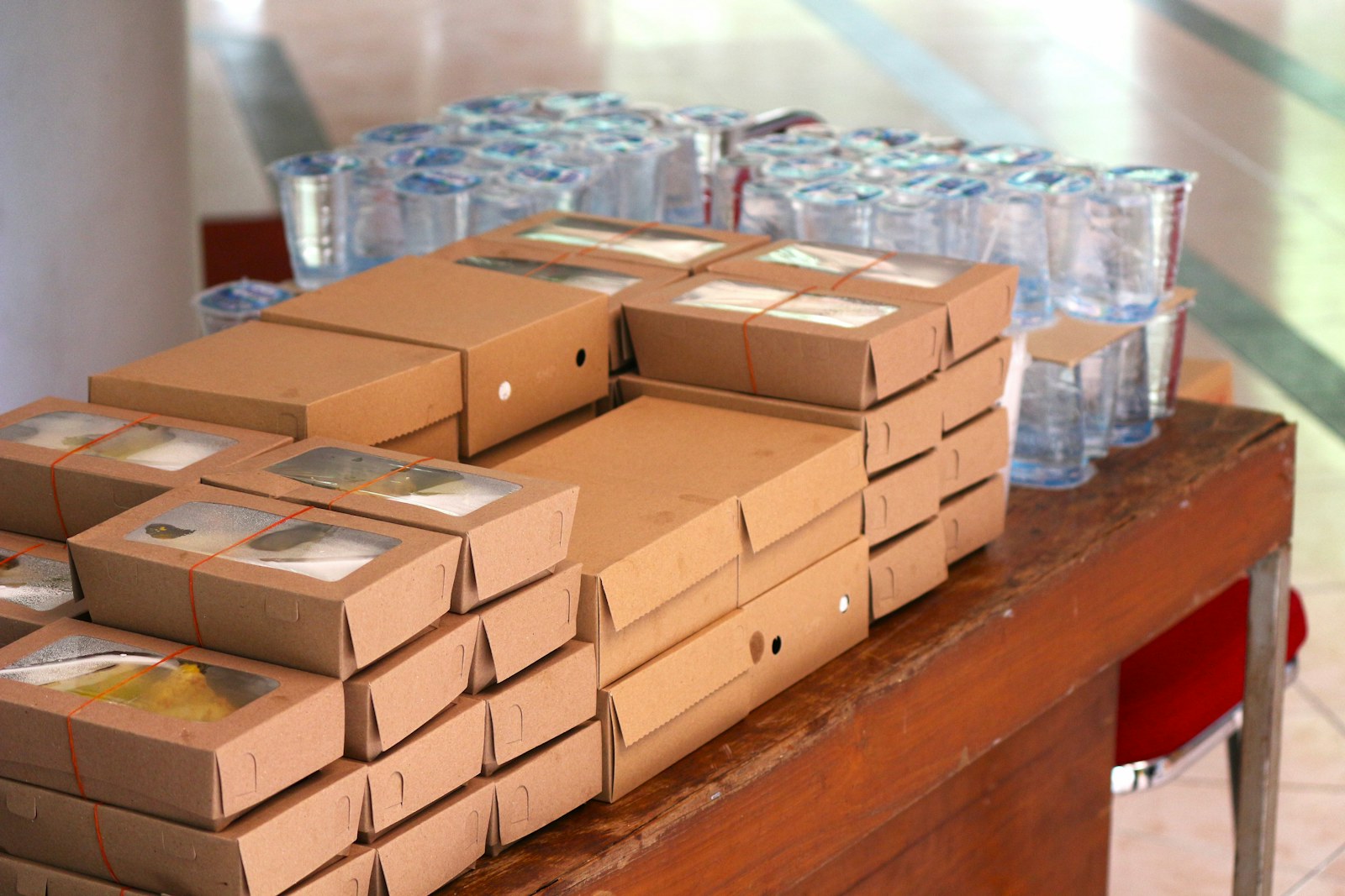 A small business owner packing online orders for shipment